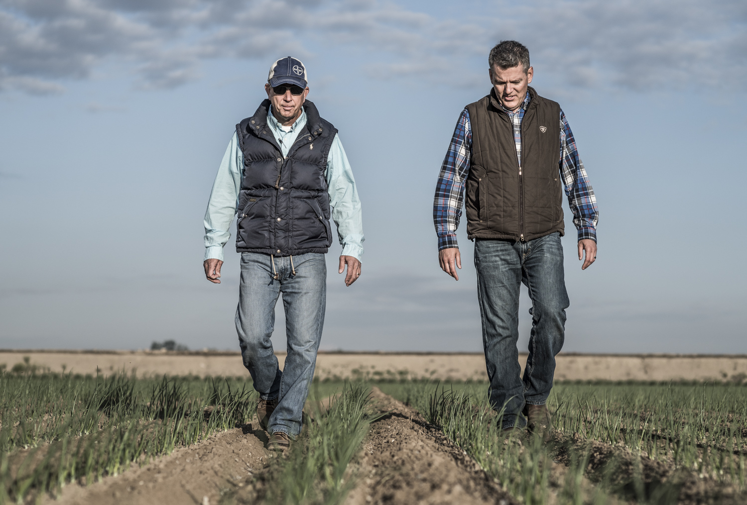 Farmers walking in field
