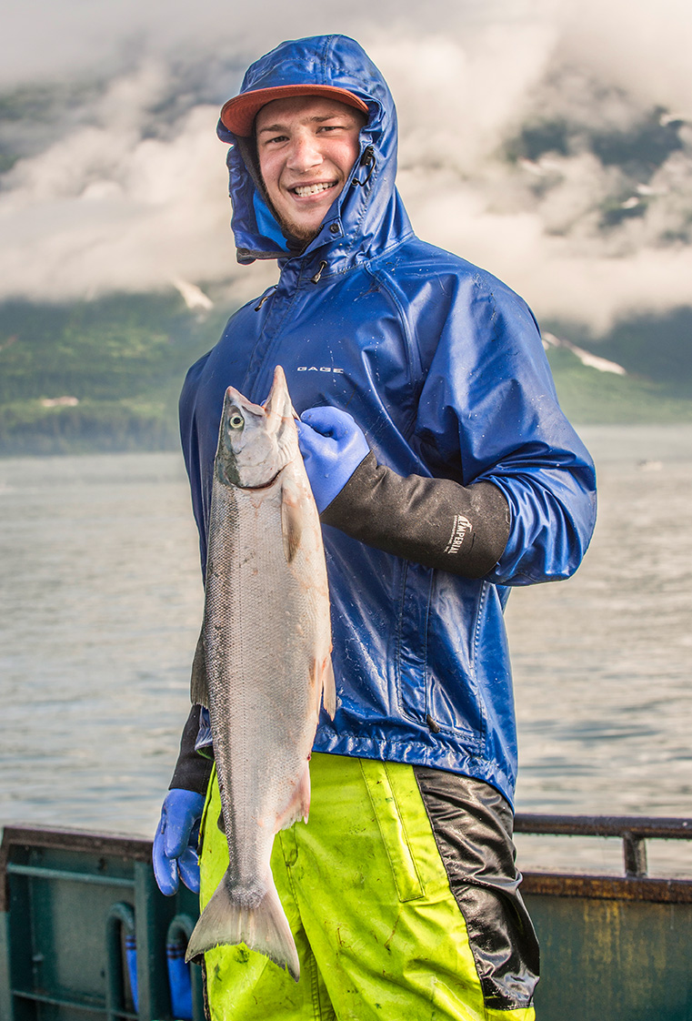 Alaska commercial fisherman holding salmon Boise Commercial